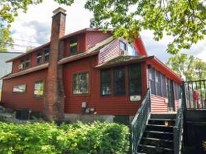 exterior of a large red house