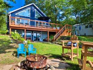 back of lake house and outdoor seating area