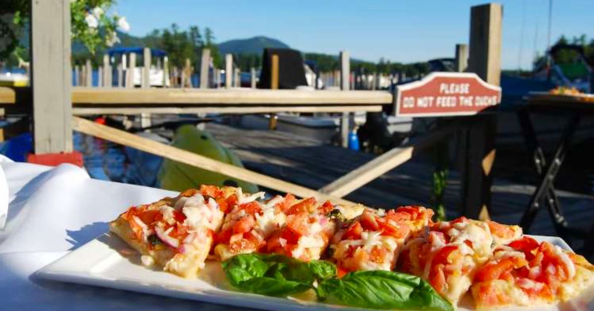up close of food on plate with docks in background view